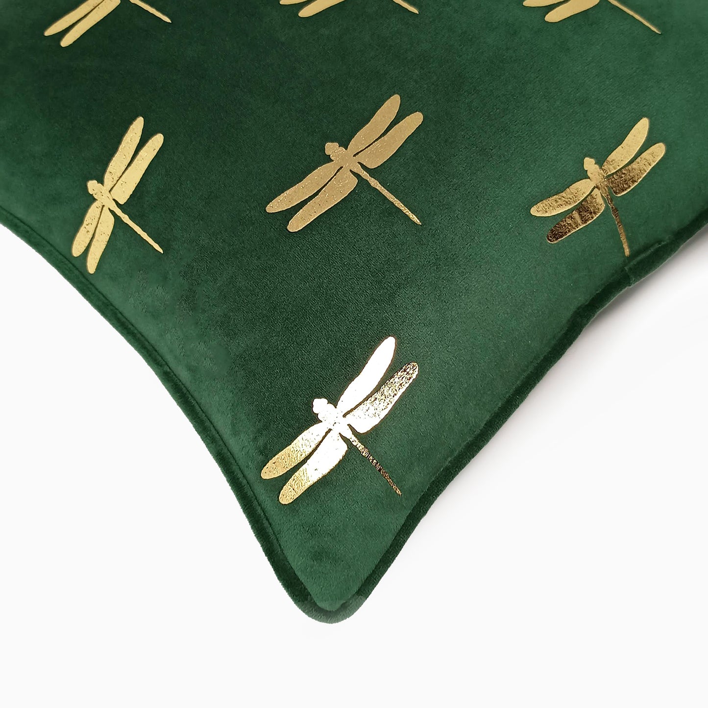 Dragonfly foil print velvet cushion cover in dark green, diagonal side view